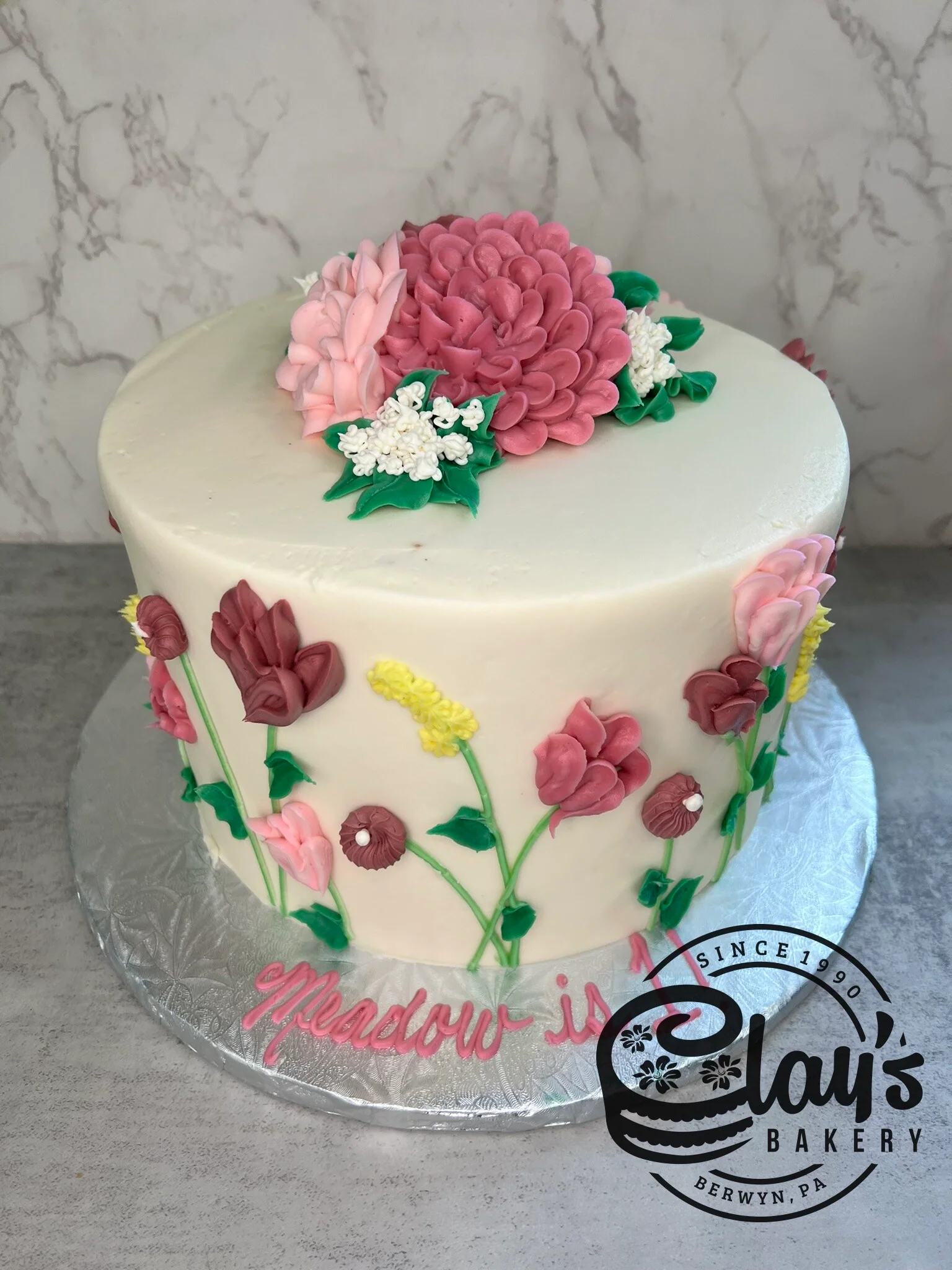 Mauve Spring Flowers up the Side - Three Layer Cake